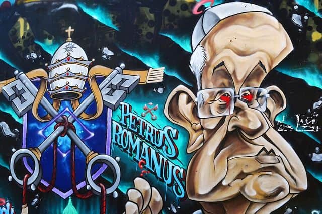 Die okkulte Symbolik der vatikanischen Krippe: Ein Graffiti von Jorge Bergoglio als Karikatur mit Papstinsignien
